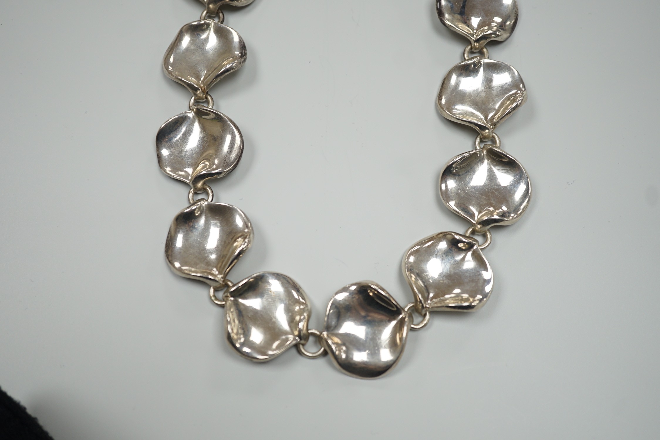 A modern Georg Jensen style silver necklace, with stylised petal links, maker AoL, London, 2008, 44cm, 189 grams.